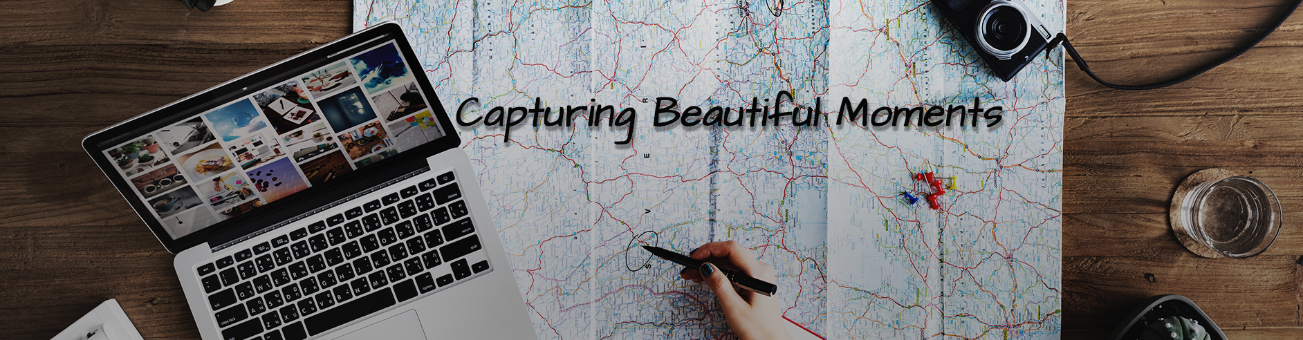 Capturing Beautiful Moments, a map, a laptop and a camera, planning my next trip
